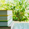 Books on table, tree in background