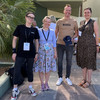 Sabine Lauer, Olga Wagner, Uwe Wilkesmann, Ronja Vorberg at the EGOS Conference. Wilkesmann wears a T-shirt, cap and necklace with the word "Boss" to match the title of the lecture.