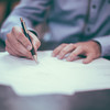 Person signing documents.