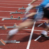 Several Sprinter are starting side by side from starting blocks.