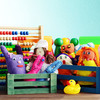 Two boxes with toys like stuffed animals, arubber duck and an abacus.