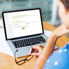 Woman sitting in front of her laptop