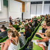 Students sit in a lecture at the beginning of the study.